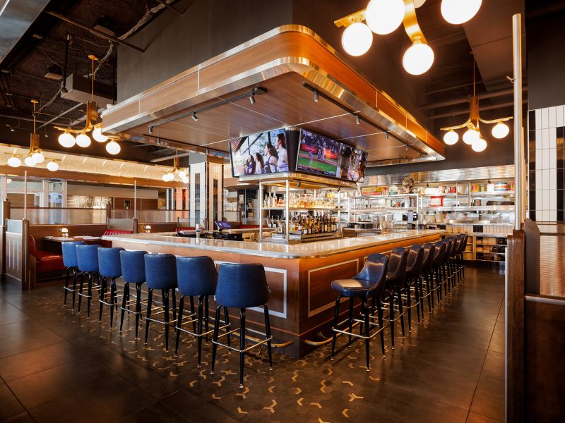 Cameron Mitchell Restaurant's Cap City Diner Cincinnati bar with kitchen in background